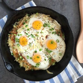 Cheesy hash browns topped with eggs and green onions. Easy one pot breakfast recipe!