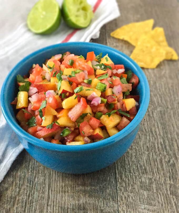 This peach salsa recipe is made with sweet fresh peaches and tomatoes. It makes a tasty dip for tortilla chips, but it's also a delicious topping for fish or pork!